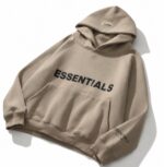 Beige unisex Essentials hoodie with cozy hood and front pocket.