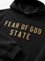 FOG Essentials black fleece hoodie with logo and relaxed oversized fit for streetwear style.